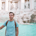 Tossing coin into Trevi Fountain